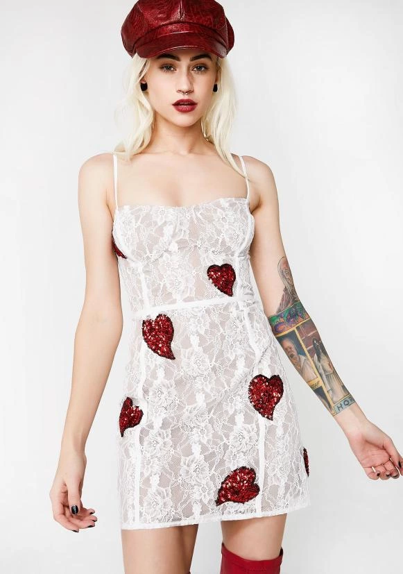 For Love &amp; Lemons La Christy Mini Dress Will Make ‘em Feel Your Luv. This Sheer White Lace Mini Dress Is Part Of The Jamie King Collab And Has A Structured Bust, Adjustable Skinny Straps, And Red Sequin Hearts All Over.