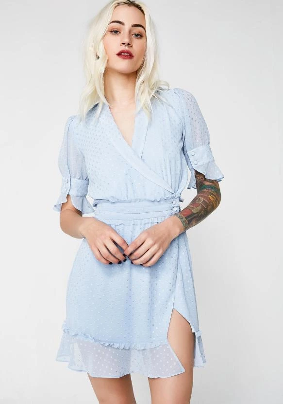 For Love &amp; Lemons La Karla Mini Dress Got Ya Feelin’ Cute N’ Flirty. This Adorable Light Blue Mini Dress Is Part Of The Jamie King Collab, And Has A Faint Dotted Pattern N’ A Wrap-style Front With A Button Closure On The Side.